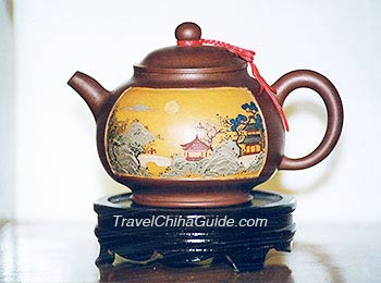 Tea pot with delicate paintings